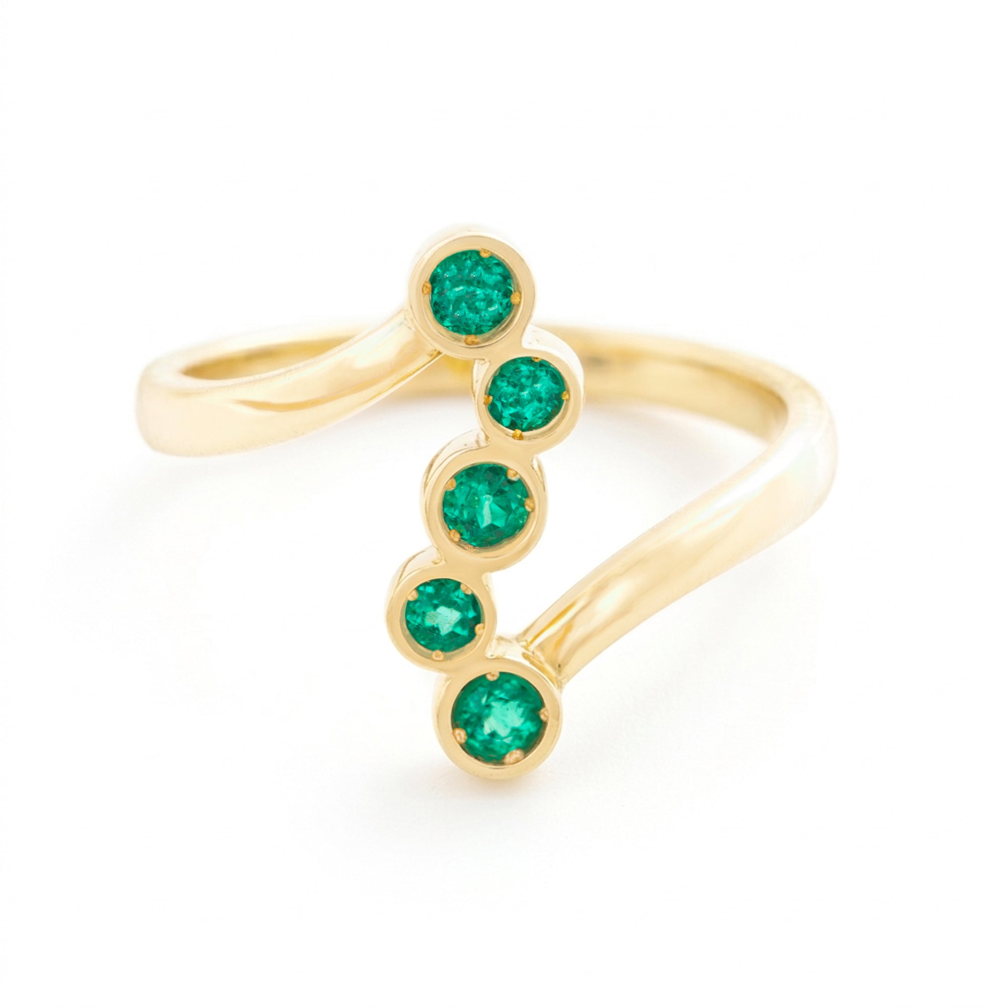 ANILLO CRUZADO CON ESMERALDAS