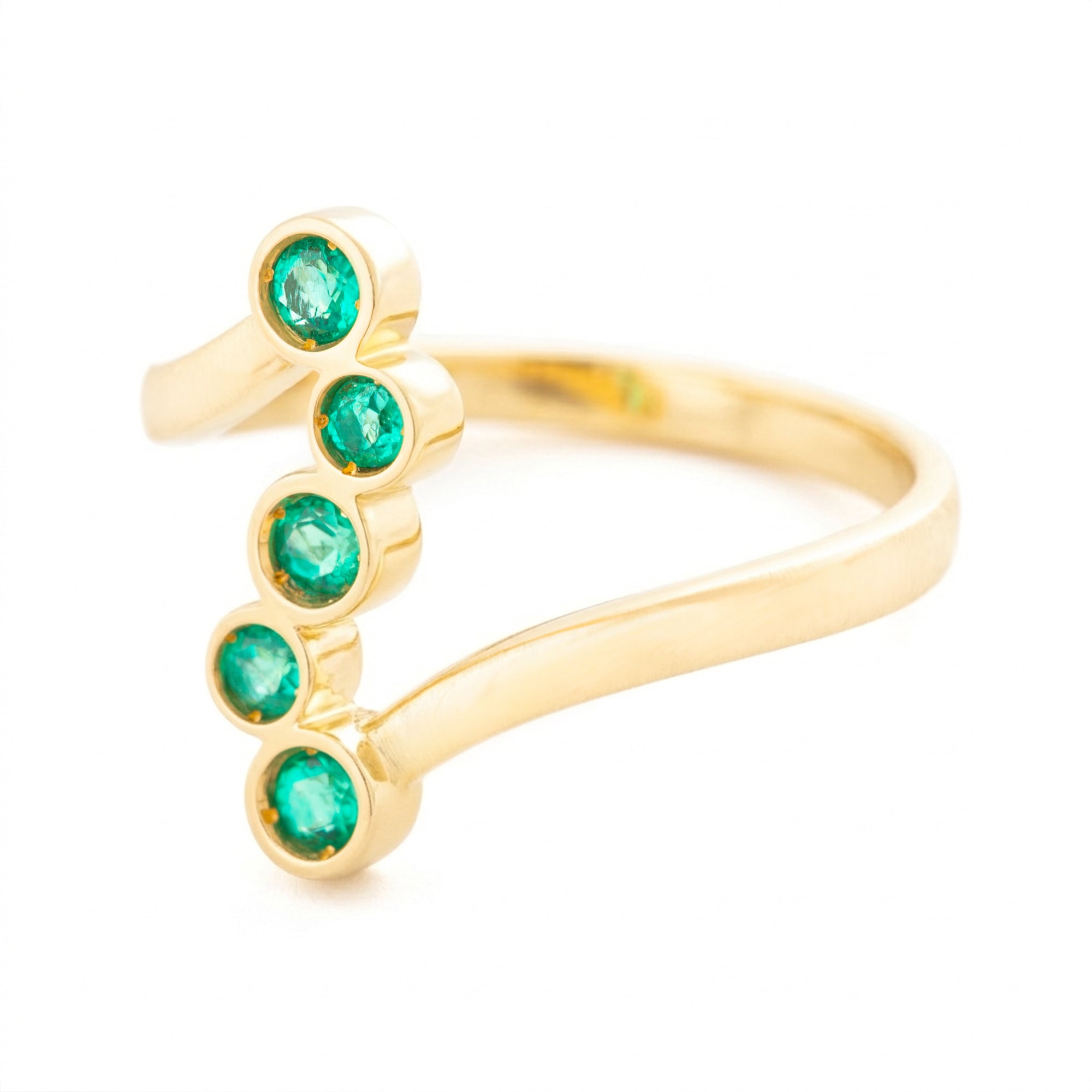 ANILLO CRUZADO CON ESMERALDAS