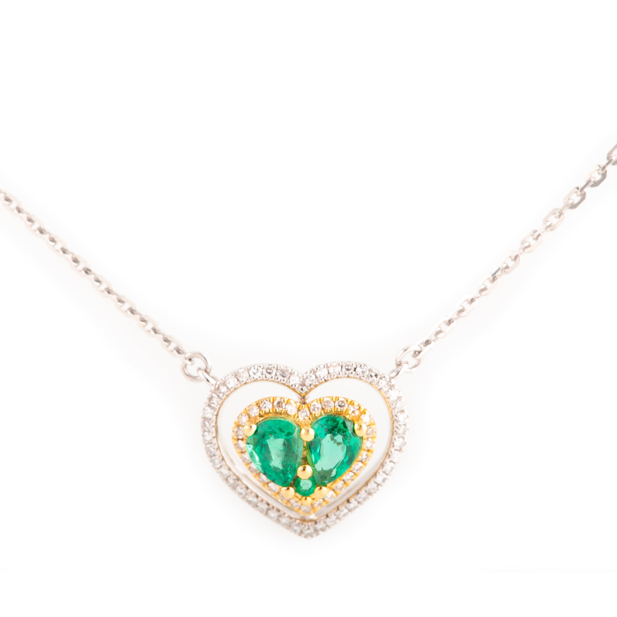 Gargantilla de corazones en  2 oros con diamantes y esmeralda