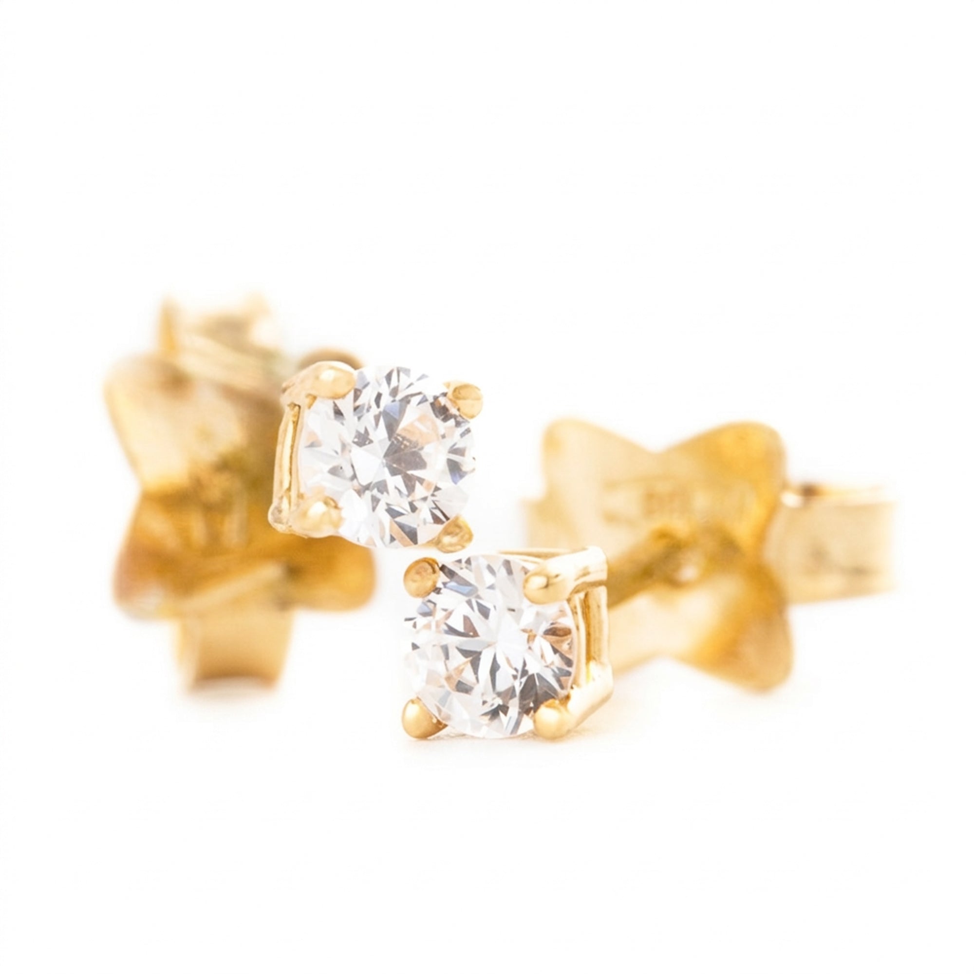 ARETES ZIRCÓN UÑAS