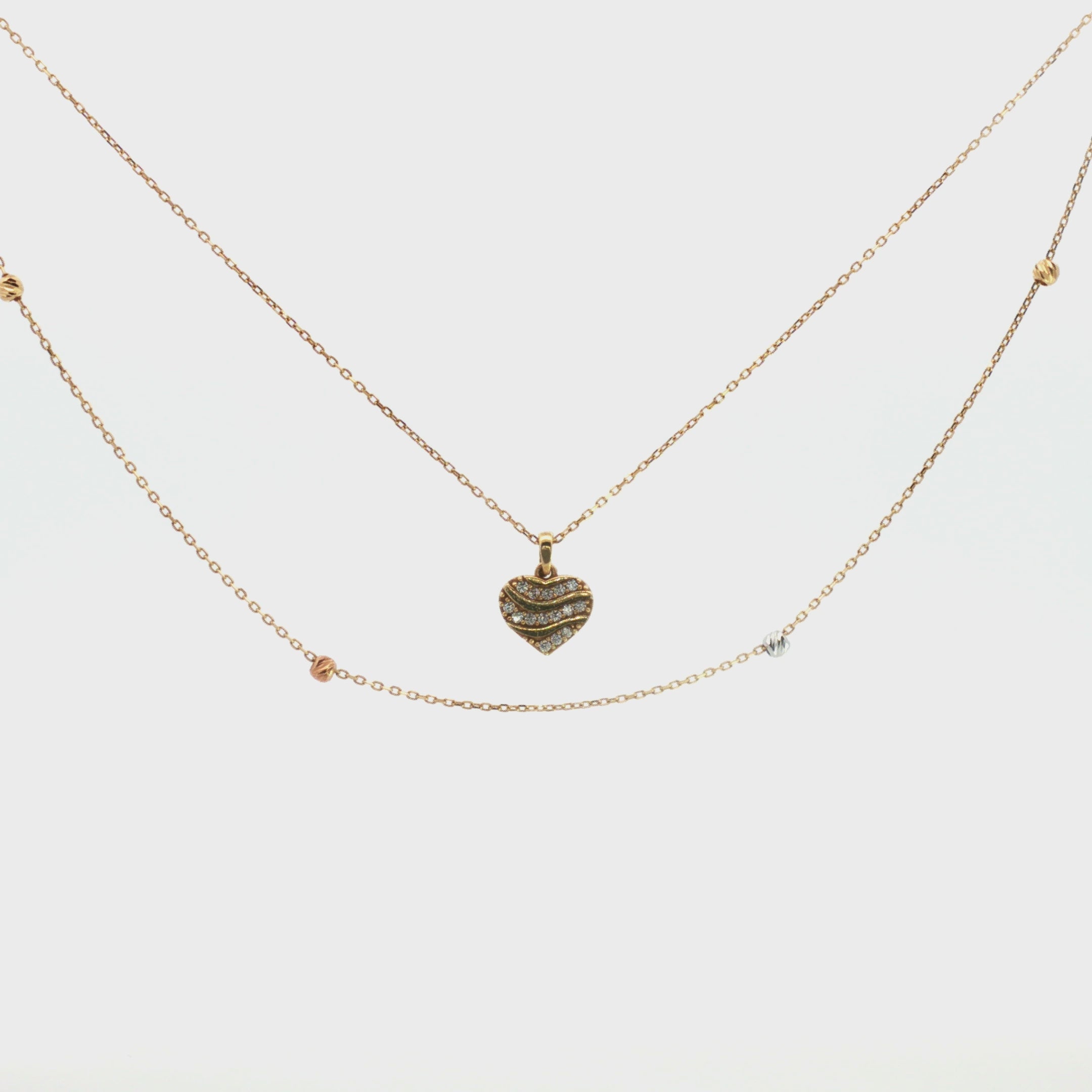 GARGANTILLA DOBLE CORAZÓN Y BOLA DIAMANTADA
