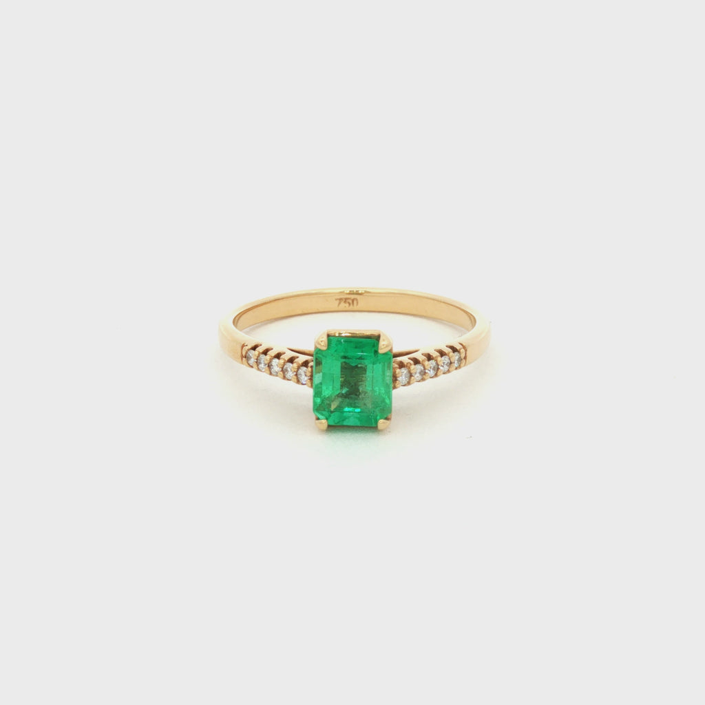ANILLO SOLITARIO CRUZADO CON ESMERALDA Y DIAMANTES