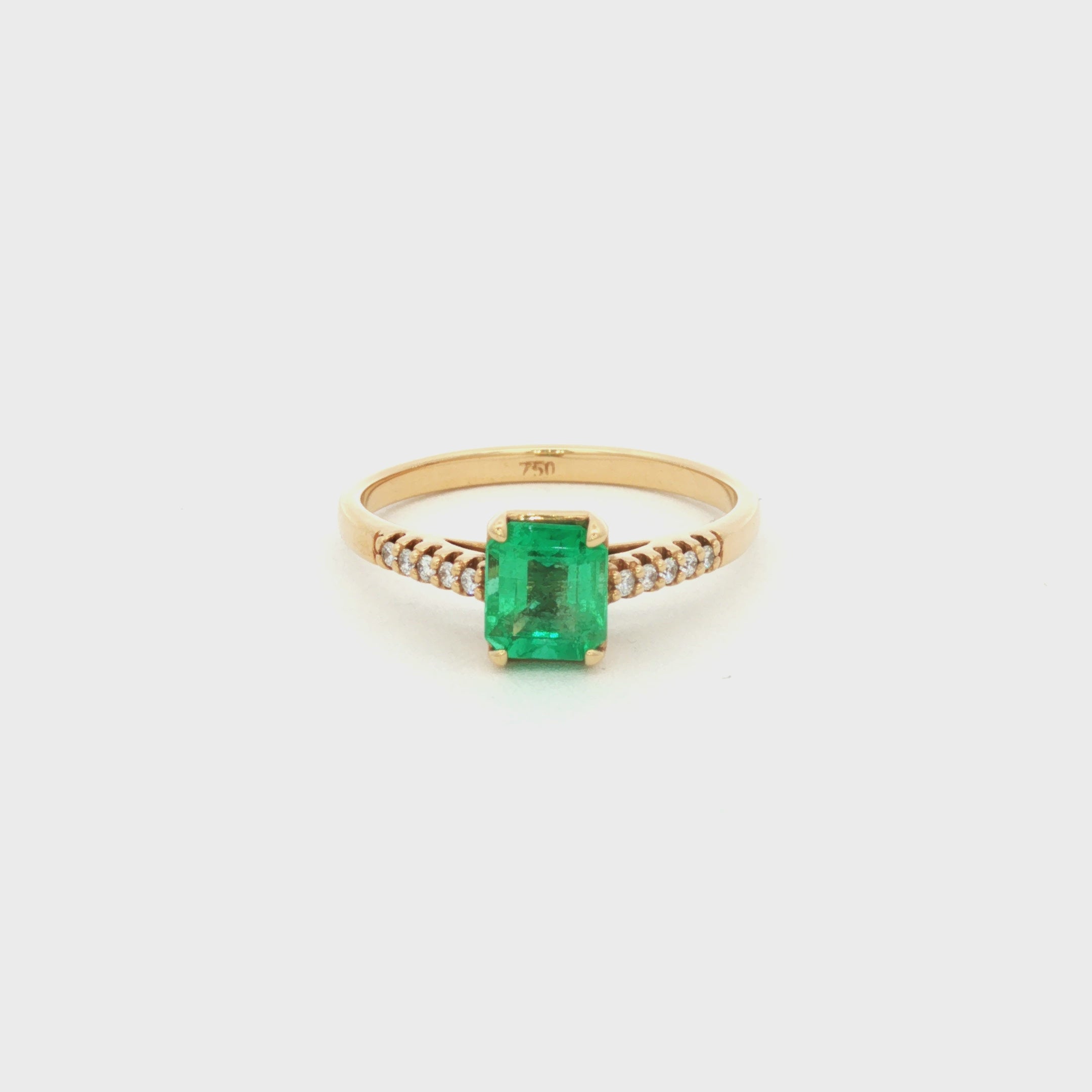 ANILLO SOLITARIO CRUZADO CON ESMERALDA Y DIAMANTES