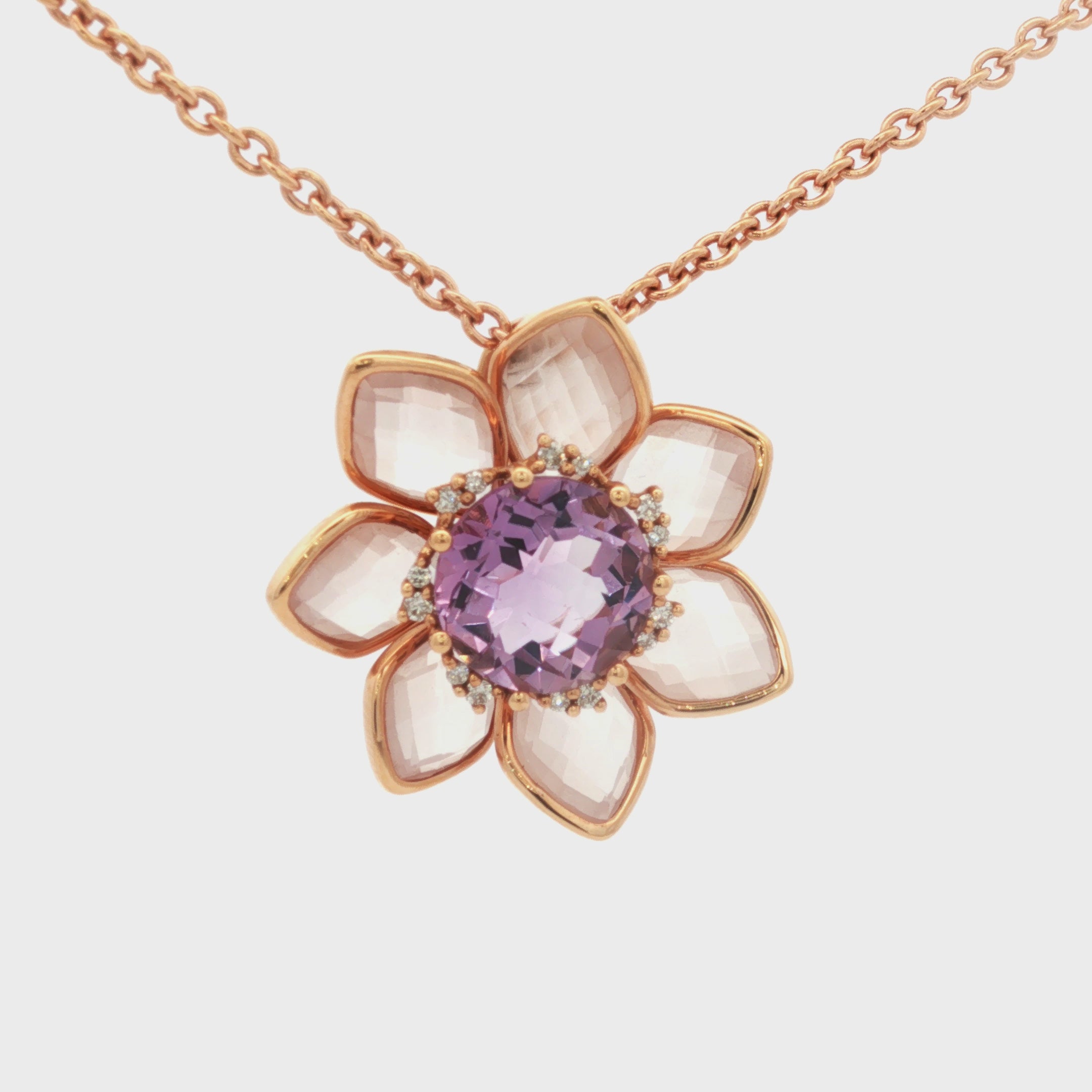 DIJE FLOR CON PÉTALOS EN CUARZO Y AMATISTA